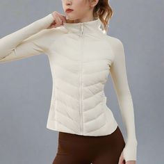 Stay warm and stylish with our Women's Ultralight Sport Puffer Jacket, the ultimate puffer jacket for active women. Perfect for running and outdoor activities, this puffer jacket features seamless splicing, down insulation, and a lightweight design for ultimate comfort. The sleek, modern look ensures you stay on-trend, while the functional design offers practicality for your active lifestyle. Whether you're hitting the trails or running errands, our puffer jacket keeps you cozy without compromis Womens Athletic Outfits, Fitness Technology, Puffer Jacket Women, Athletic Apparel, Active Women, Active Lifestyle, Knit Sweater Cardigan, Spring Collection, Functional Design