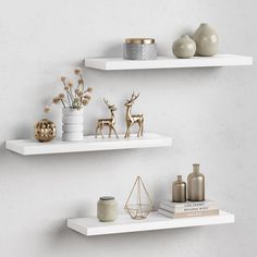 two white shelves with decorative items on them