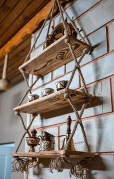 some shelves with tea pots and cups on them