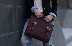 "Bag. Link to the bags section - https://www.etsy.com/shop/Pikore?ref=shop_sugg&section_id=24287075 Looking for a satchel bag that will be spacious enough to carry your laptop but simple and elegant in design? A leather women laptop bag is an ideal solution to meet your demands. MAIN CHARACTERISTICS: - Sizes: 🔸 The bag is made according to the dimensions of your laptop. (Please, leave your laptop dimensions in the Notes box at the checkout page). - Pockets:   Front internal:  🔸 Smartphone pocket;  🔸 2 pen holders;  🔸 3 slots for cards.   Backside internal:  🔸 Zip pocket;  🔸 Plain pocket - 20 x 12 cm (7.8 x 4.7\"); - Flap messenger bag; - Hidden magnets closure; - False buckles; - Top handle; - Detachable shoulder strap 140 x 2.5 cm (55 x 1\"); - Brass or silver metal hardware to choo Work Bags Laptop, Womens Work Bag, Messenger Bag Women, Leather Briefcase Bag, Laptop Handbag, Briefcase Women, Laptop Messenger Bags, Laptop Bag For Women, Black Leather Satchel