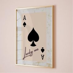 a framed playing card with the words lucky me on it and spades in each