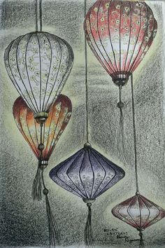 three hot air balloons are hanging from strings