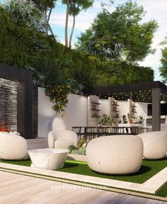 an outdoor living area with white furniture and plants