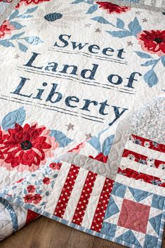 a quilt with the words sweet land of liberty on it