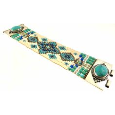 Chili Rose Beaded Turquoise & Gemstone Bracelet by Adonnah Langer of Santa Fe, New Mexico Gorgeous Diana Bracelet features a Southwestern blend of turquoise, olive green and red Swarovski beads handcrafted with a true artistic mix of beads and a canvas of gorgeous colors. Gorgeous Turquoise Oval Medallions Grace the ends of this woven beaded bracelet *Measures 6 3/4 inches to 7 1/2 inches- please specify (made to order) *Medallion measures 1 1/4 inch x 7/8 inch *Sterling Silver .925 *Hidden Lock Artisan Green Handmade Bracelets, Artisan Turquoise Bracelets For Gift, Turquoise Beaded Fusion Jewelry, Bohemian Turquoise Cuff Bracelet With Round Beads, Handmade Artisan Turquoise Bracelets, Handmade Southwestern Green Beaded Bracelets, Handmade Green Southwestern Beaded Bracelets, Artisan Turquoise Cuff Bracelet With Natural Stones, Turquoise Artisan Cuff Bracelet With Natural Stones