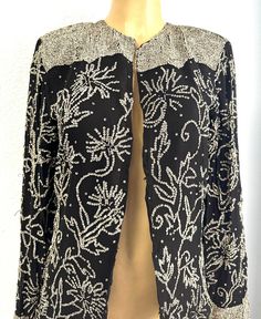 This lace blazer coat is all hand beaded with sequins perfect for parties and special events. Fitted Sequin Outerwear For Holidays, Long Sleeve Sequined Blazer For Evening, Elegant Long Sleeve Outerwear For Party Season, Sequin Wedding Blazer For Winter, Winter Wedding Sequin Blazer, Elegant Embellished Evening Outerwear, Fitted Embellished Outerwear For Party, Embellished Fitted Party Outerwear, Elegant Holiday Sequin Outerwear