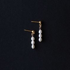 When the occasion calls for a little something extra, our mini Pearl Earrings are the perfect fit. These lightweight earrings are a striking drop style with freshwater pearls.A classic piece of timeless jewelry, these would be the perfect gift for a bride or bridesmaid Details: Size: .75” ling Earring post material: 14k gold fill (100x more real gold than plated materials), perfect for those with sensitivities All profits from the sale of our ethically made jewelery are donated to charity, you c 14k Gold Dangle Pearl Earrings, Delicate 14k Gold Filled Earrings With Pearl Chain, 14k Gold Dangle Linear Earrings With Pearl Drop, 14k Gold Filled Pearl Chain Earrings As Gift, Dainty Drop Earrings With Pearl Chain, 14k Gold Filled Drop Pearl Earrings, Dainty Long Drop Linear Earrings With Pearl Drop, 14k Gold Earrings With Pearl Chain For Gift, 14k Gold Pearl Chain Earrings As Gift