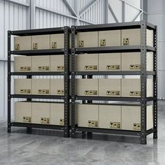 two shelving units with boxes stacked on top of each other in an industrial building