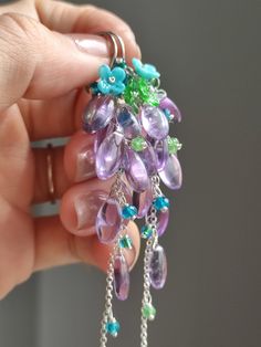 Just like the spring breeze bringing a faint fragrance of grass. Time is slow, everything is gentle and calm. ●amethyst ●apatite ●tsavorite ●seed beads ●925 silver ●total length: 87mm ● weight：6.7g Welcome to visit my Jewelry store: https://www.etsy.com/shop/Ukuly 🌸The delivery time to Most regions of North America, Australia and Europe is usually about 10-15 days. Buyers from Brazil, South Korea, and Indonesia, please provide me with your tax number through messages or notes for smooth shipmen Lavender Amethyst, Spring Breeze, Earrings Purple, Shipping Label, Earrings Unique, Birthday Gift For Her, Cluster Earrings, Floral Earrings, Spring Floral