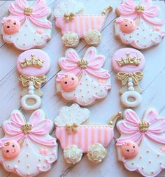 baby shower cookies decorated with pink and gold decorations