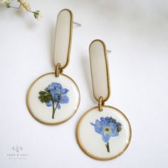 Artist Earrings Artist Earrings, Diy Resin Projects, Real Flower Jewelry, Resin Ideas, Modern Shapes, Resin Projects, Pressed Flower Art, Colored Background, Plastic Jewelry