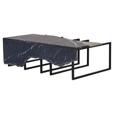 three black and white marble tables with metal frames on each side, one in the shape of a rectangle