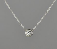 "18 kt white gold pendant. Set with 0.52 carat G-VS2 diamond. The Diamond can be upgraded in size or quality or lesser size and quality. The pendant comes with an 18 kt 1.1 mm 16\" cable chain.  The Diamond is certified." Silver Solitaire Necklace With Single Cut Diamonds In Platinum, Silver Platinum Solitaire Necklace With Single Cut Diamonds, Platinum Diamond Necklace With Bezel Setting In Silver, Silver Platinum Diamond Necklace With Bezel Setting, Gold Pendant Set, Sterling Silver Rings Set, Peridot Earrings, White Gold Pendant, Vs2 Diamond