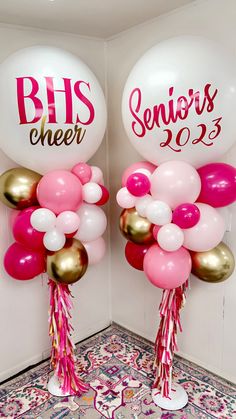 two balloons with the words bhs cheer on them