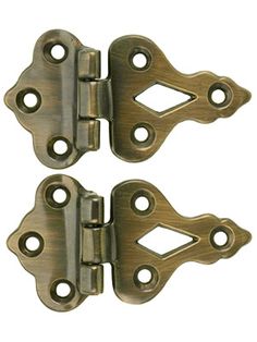 pair of antique brass plated cabinet door hinges