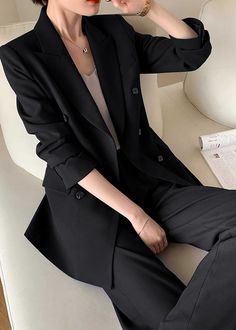 Elevate your professional wardrobe with the Monica Black Pants Suit Two-Piece Set. Crafted with a sophisticated black hue and double-breasted closure, this set exudes luxury and exclusivity. The straight-leg pants and tailored blazer provide a timeless and tasteful look for any business occasion. Blazer: Double Breasted closure Notched lapels Long sleeves Front flap pockets Pants Zip fly with button closure Side slant pockets Regular length - Polyester, spandex- Item #43197- Women's blazer & pan Tailored Suits Women, Elegant Black Suit With Double-breasted Button Fastening, Black Double-breasted Blazer For Business, Black Formal Office Lady Suit, Black Office Lady Suit For Formal Events, Elegant Black Double-breasted Suit, Chic Black Double Breasted Suit With Long Sleeve, Black Double-breasted Notch Lapel Suit, Tailored Black Double-breasted Blazer