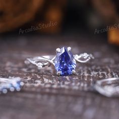 a tanzante ring sitting on top of a wooden table