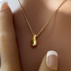 Showcase you love of water with our stunning and modern Wai Raindrop pendant. Water is life in Hawaii and this beautifully designed pendant is sure to add elegance and sophistication to any outfit. .925 Sterling Silver Approx. 1/2" Tall Available in 14K Gold Plated or Silver Includes 18" Adjustable chain w/1" extension Sterling Silver Drop Jewelry, Formal Drop Necklace With Clavicle Chain, Modern Hypoallergenic Drop Jewelry, Formal Drop Clavicle Chain Necklace, Minimalist Drop Jewelry For Anniversary, Sterling Silver Drop Necklace For Everyday, Classic Teardrop Drop Necklace Gift, Sterling Silver Drop Necklace For Gift, Everyday Sterling Silver Drop Necklace