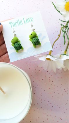 Super cute Turtle earrings, made from resin, in green colors. The closure is leverback, which is very comfortable and easy to wear, just click the back up and you're ready to show them off. The leverback makes sure the earrings will not fall out of your ear and it doesn't require additional pieces to make them secure. Packaging Materials: cardstock backing, holographic ziplock Size: 4 cm (total lenght) 1.5 cm (width) Find Me Here: Facebook: https://www.facebook.com/craftachicdesigns Instagram: h Adjustable Green Fun Jewelry, Whimsical Green Nickel-free Jewelry, Cute Handmade Green Jewelry, Cute Green Jewelry Gift, Green Handmade Fun Earrings, Green Fun Earrings For Gift, Green Fun Earrings For Gifts, Fun Green Earrings For Gifting, Fun Green Earrings For Gifts