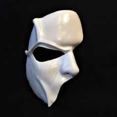 a white mask on a black background