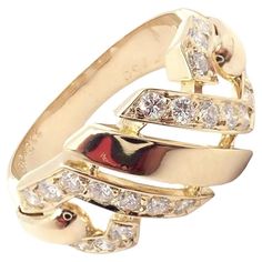 18k Yellow Gold Fox Trot Diamond Ring by Cartier from the 1980's Ring Size 6.5. With 20 round brilliant cut diamonds VVS1 clarity, E color total weight approximately 0.50ct This stunning ring comes with a Cartier box. Details: Weight: 6 grams Ring Size: 6.5 Width at Top: 10mm Stamped Hallmarks: Cartier 750 601XXX(serial number has been omitted) French Hallmarks Includes copy of Cartier valuation report from 1995 *Free Shipping within the United States* YOUR PRICE: $5,250 3052mded Cartier Vintage, Fox Trot, Gold Fox, Vintage Fox, Yellow Gold Diamond Ring, Top Rings, Cartier Jewelry, Gold Diamond Rings, Love Bracelets