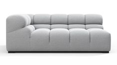 a gray couch sitting on top of a white floor