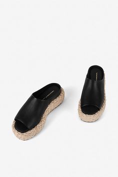 Leather upper Memory foam insole Rubber sole Raffia heel Slip-on styling Imported | Hightide Sandals by Intentionally Blank in Black, Women's, Size: 9, Leather/Rubber at Anthropologie Intentionally Blank, Black Sandals, Memory Foam, Rubber Sole, Leather Upper, Anthropologie, Slip On, Sandals, Luxury Fashion