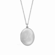 Our new, timeless oval locket necklace is an elegant way for you to carry your loved ones close to your heart. Hold pictures of your loved ones or a memento that is special to you. Engrave an initial on the front and up to 3 names/phrase on the back. available in gold vermeil and sterling silver lockets are engraved using diamond drag technology opens with space inside for 2 pictures, which fit easily inside the locket. See our guide for adding photos to your locket hangs on adjustable length ro Classic Customizable Initial Pendant Necklace, Elegant Oval Link Locket Necklace, Elegant Oval Locket Necklace As A Gift, Elegant Oval Link Locket Necklace For Wedding, Elegant Oval Locket Necklace For Gift, Customizable Classic Initial Pendant Jewelry, Classic Customizable Initial Pendant Jewelry, Elegant Oval Link Keepsake Necklace, Wedding Locket Necklace With Oval Link