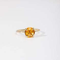 Citrine ring in 14K solid gold.  A modern and timeless ring with a natural Citrine yellow gemstone. A perfect gold ring for women, dainty and subtle that adds glam to every outfit. Citrine is November birthstone, so it is a great birthday gift for her. 100% handcrafted with love! ● Metal: 14K solid gold, 14K white gold ● Gemstone: Citrine, briolette cut ● Stone Diameter: 8 mm (0.3 in)  ● Choose from the drop down menus the available options (Material, Ring size) and leave us a note for any special requirements. ● All our pieces are delivered beautifully packaged and gift ready, with a certificate of authenticity for the metal and the stone.  Please keep in mind that each item is handcrafted and we need 3-5 days at least for its production. If you need your order on a specific date, please Citrine Birthstone Jewelry In Round Cut, Citrine Birthstone Jewelry Round Cut, Timeless Citrine Gemstone Rings, Yellow Topaz Center Stone Ring In 14k Gold, Modern Topaz Ring With Center Stone In Yellow Gold, Classic Yellow Sapphire Gemstone Jewelry, Modern Yellow Gold Topaz Ring With Center Stone, Yellow Gold Citrine Jewelry With Round Cut, Yellow Gold Citrine Jewelry Round Cut