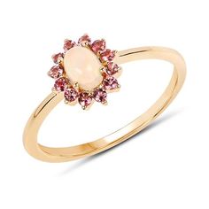 This delicate little ring brings together both October birthstones in one beautiful piece! Ethopian Opal and pink tourmaline are a gorgeous combination of color. They will not disappoint! Set in fine 14K yellow gold, this is a gift that will be treasured for a lifetime or spoil yourself with a beautiful treat! ALL proceeds help rescued animals so you can feel good about your purchase and you will never pay retail with us. Thank you for shopping with us! We look forward to serving you. Your jewel Ethiopian Opal Jewelry, Crossover Diamond Ring, Pink Tourmaline Ring, Opal Ring Gold, Diamond Cocktail Rings, Tourmaline Ring, October Birth Stone, Opal Jewelry, Cocktail Ring