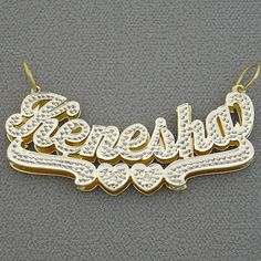 "*2 Inches Wide Personalized Solid 10K or 14K Gold Name Pendant 3D Double Plates Charm, fancy script unique font design, name and bottom heart design tail hand carved diamond accent in white tone Rhodium. *Average Name Pendant Dimension: 2 Inch (50 mm) X 3/4 Inch (19 mm) Approx. *Up to 9 Letters - Only first letter capitalized. *Thickness Top: 0.7 mm / 22 Gauge / 0.028\" Approx. *Thickness Bottom: 0.40 mm / 26 Gauges / 0.018\" Approx. *This solid gold 3D name pendant cut out by latest technology Custom Gold Nameplate Jewelry, Gold Nameplate Jewelry With Names, Custom Gold Name Jewelry, Custom Gold Jewelry With Custom Name, Custom Gold Jewelry With Name, Custom Gold Jewelry For Personalized Gift, Custom Personalized Gold Jewelry, Gold Jewelry With Names For Formal Occasions, Gold Formal Jewelry With Names