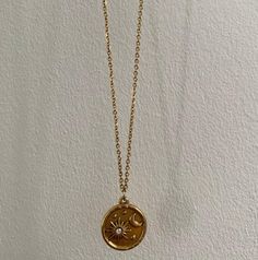 Sun and Moon, Celestial Necklace with a cubic zirconia gemstone.  Material is gold plated, stainless  steel so completely tarnish free, safe in water and won't leave you with any stains.  Sizing: 39cm. Comes with gorgeous packaging so this can always work as gift for someone else! Minimalist Gold Necklace With Sun And Moon Design, Gold Plated Necklace With Moon Charm Gift, Celestial Round Charm Necklace With Clavicle Chain, Gold Charm Necklaces With Moon Phase As Gift, Gold Celestial Clavicle Chain Necklace, Gold Necklace With Moon Charm, Gold Necklace With Moon Charm And Round Pendant, Dainty Gold Plated Moon Phase Necklaces, Gold Plated Moon Phase Round Necklace