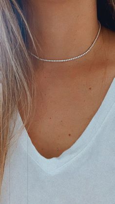 Cubic Zirconia Tennis Necklace | 14K Gold Filled | 2.2 MM Diamond Tennis Choker Necklace | Bridal Jewelry | Dainty Minimalist Necklace ------------------------------------------------- ♦ --------------------------------------------------- Beautiful Tennis choker necklace. It compliments any outfit. A wonderful gift for yourself or for any loved one and friend - purchase one today!♦ Materials: 18K Gold Filled ♦ Available colors: Gold ♦ Necklace measurements: the total length is 15.5" and the ston Minimalist Cubic Zirconia Tennis Necklace, Minimalist Cubic Zirconia Jewelry With Diamond Cut, Dainty White Gold Diamond Necklace With Sparkling Stones, Minimalist Diamond Tennis Necklace, Dainty Round Cubic Zirconia Tennis Necklace, Dainty Jewelry With Sparkling Round Cut Stones, Delicate White Diamond Necklace With Clavicle Chain, Minimalist White Diamond Necklace For Wedding, Dainty White Necklace With Brilliant Cut