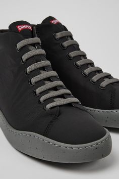 Dynamic High-top Lace-up Sneakers With Rubber Sole, Dynamic Lace-up High-top Sneakers With Rubber Sole, Sports High-top Boots With Contrast Sole, Sporty High-top Boots With Contrast Sole, Black Nylon High-top Sneakers With Vibram Sole, Sporty Boots With Contrast Sole For Sports, Modern Lace-up Sneakers With Recycled Rubber, Modern Lace-up Sneakers Made Of Recycled Rubber, High-top Sneakers With Recycled Rubber Sole