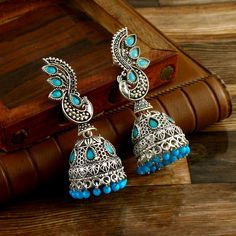 Overview These stylish Earrings set from JewelryTrack will certainly leave you spellbound. These Earrings set have an excellent finish and gives out an exquisite sense of style. If you are looking for an amazing Fashion Jewelry set for special occasions such as Anniversary, Engagement, Party, Wedding or for gifting , then your search ends here.  Item Description Item: Oxidized Silver Plated Handmade Jhumki Earrings COLOR : Silver OCCASION: PARTY WEAR , WEDDING, MARRIAGES, CASUAL, DAILY WEAR Ideal For Gifting Please contact us for Bulk Orders. Seller Info: We are Aiming to supply best products to customers at best price. We believe good product nothing without good customer service. We always there for any query or help understanding something. Payment: We accept Payment Only Via PayPal ,It Bollywood Style Turquoise Earrings For Gift, Blue Bohemian Jhumkas For Festive Occasions, Festive Blue Bohemian Jhumkas, Festive Bohemian Blue Jhumkas, Blue Bohemian Danglers For Wedding, Blue Metal Earrings With Latkans, Turquoise Chandbali Earrings For Diwali, Blue Festive Danglers, Blue Festive Jhumkas Drop Earrings