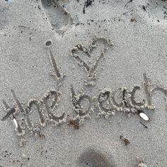 the word love is written in the sand