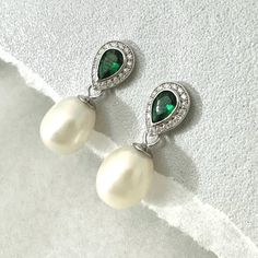 Personally Designed green Emerald and Freshwater Pearl Earrings perfect for special occasions, weddings and anniversary gift. Medium sized drop pearl earrings using carefully selected natural freshwater pearls with elongated shapes to compliment the emerald earrings, evening earrings for special occasions. Everyday drop earrings.  These classically designed earring are made with beautifully faced deep Green emerald and Teardrop shaped genuine Fresh Water Pearls. 💎 Material: Sterling Silver or 18K Yellow Gold Vermeil 💎 Gem Stone: AAA Freshwater Pearls, Green Emeralds with small clear topaz gemstones.  💎 Gemstone Shape: teardrop  💎 Total length 24mm drop  💎 Size of pearls: 7*10mm approximately, natural pearls are all individually unique, please allow slightly different sizes. I would do Cubic Zirconia Teardrop Earrings For May Birthstone, May Birthstone Teardrop Cubic Zirconia Earrings, Elegant Gemstone Teardrop Earrings For Anniversary, Elegant Drop Jewelry With May Birthstone, Sterling Silver Teardrop Clip-on Earrings For Wedding, Pear-shaped May Birthstone Earrings For Anniversary, Pear-shaped Earrings For Anniversary With May Birthstone, Anniversary Pear-shaped May Birthstone Earrings, Elegant Emerald Earrings