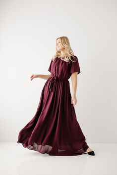 Elegant and feminine, the 'Alexandra' Maxi Dress is perfect for any dressy occasion! This dress features a modest crew neckline, flowy sleeves, a tie waistband and it is fully lined! Pair with wedge sandals for a wedding, a denim jacket and booties for a Sunday morning, or style with fun accessories for a photoshoot. The possibilities are endless! This beautiful dress was made exclusively with you in mind! Self & Lining100% Polyester Hand Wash Cold Do Not Bleach Lay Flat to Dry Low Iron if Needed Do Not Dry Clean Fully Lined Model Height 5'6" | Wearing Size Small Model Height 5'10" | Wearing Size 1X Please carefully measure a similar item before placing your order to allow for the best fit and also to reduce the risk of returns. Have questions about fit? Call us! We try everything on, so w Flowy Chiffon Dress With Tie Waist, Flowy Chiffon Maxi Dress With Tie Waist, Chiffon Tie Waist Maxi Dress, Chiffon Maxi Length Dress With Tie Waist, Flowy Tie Waist Dress For Formal Occasions, Formal Flowy Dress With Tie Waist, Formal Belted Flowy Dress, Modest Midi Dress With Tie Waist, Modest Wardrobe