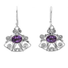 Shaped like an ornate bell these delightful earrings showcase modern Balinese style. A dazzling oval of faceted amethyst brings color and elegance to earrings from Sukartini. .925 Sterling silver Ornate Purple Jewelry With Matching Earrings, Ornate Purple Dangle Earrings, Ornate Purple Drop Earrings, Purple Earrings With Intricate Design As Gift, Purple Earrings With Intricate Design For Gift, Ornate Purple Pierced Earrings, Ornate Purple Sterling Silver Earrings, Purple Oval Earrings With Gemstone Accents, Elegant Oval Amethyst Earrings