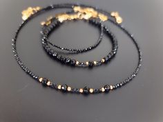 Lovely black set, chocker and 2 bracelets, made of natural black Spinel and Agate. Elegant black necklace made of   black 2mm micro faceted Spinal and natural Agate. Tiny bracelet made with small faceted 2mm Spinel beads. Black Agate bracelet made with 4mm faceted natural Agate beads. You might also like https://www.etsy.com/uk/shop/LoveIuliia?ref=l2-about-shopname§ion_id=42402163 Thank you so much for visiting my shop Iuliia xx Black Faceted Beads Choker, Black Faceted Beads Choker As Gift, Black Choker With Faceted Beads As Gift, Black Jewelry With Faceted Beads For Gift, Black Spiritual Jewelry With Faceted Beads, Black Spiritual Jewelry For Party, Spiritual Black Jewelry For Party, Black Onyx Choker Jewelry, Handmade Black Onyx Bracelets