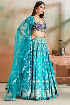 Go for a beautiful traditional look at weddings in this exquisite sea green embroidered Banarasi silk lehenga with blue embroidered blouse. The lehenga comes with a beautiful dupatta. Blue Anarkali Chanderi Lehenga, Blue Anarkali Style Chanderi Lehenga, Blue Meenakari Anarkali Set For Diwali, Semi-stitched Blue Anarkali Set With Meenakari, Blue Semi-stitched Anarkali Set With Meenakari, Festive Blue Anarkali Set With Meenakari, Blue Bollywood Sharara With Meenakari, Blue Anarkali Set With Meenakari, Blue Meenakari Anarkali Set For Festive Occasions