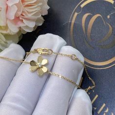 Add a touch of elegance to your wardrobe with the Frivole Gold Flower Bracelet. Crafted with intricate floral details, this bracelet exudes sophistication and charm. Made with high-quality materials, it is the perfect accessory for any occasion. Elevate your style with the Frivole Gold Flower Bracelet. ADDITIONAL INFORMATION Color: Gold Stone: Cubic Zirconia Ref. vcaro3 Material:- 925 Sterling Silver - 18k Gold Plated- 18k Real Gold ( contact us via instagram) Circumference: 17cm Our replica pro Elegant Flower Bracelets For Formal Occasions, Elegant 14k Gold Jewelry With Flower Charm, Elegant Yellow Gold Flower Jewelry, Elegant Rose Gold Bracelets With Flower Charm, Elegant Rose Gold Bracelet With Flower Charm, Elegant Diamond Flower Bracelet, Elegant Yellow Gold Flower Shaped Jewelry, Elegant White Gold Bracelets In Flower Shape, Elegant White Gold Bracelets With Flower Shape