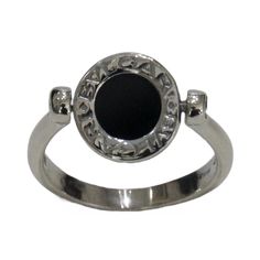 Reversible two-sided ring Size: 6.75 Elegant Silver Enamel Ring With Black Details, Formal White Gold Enamel Ring With Black Detail, Formal White Gold Ring With Black Enamel, Black Engraved Ring With Polished Finish For Formal Occasions, Luxury Hallmarked Onyx Rings, Classic White Gold Enamel Ring, Elegant Black Enamel Diamond Ring, Formal Black Engraved Ring With Polished Finish, Luxury Black Engraved Ring In Sterling Silver