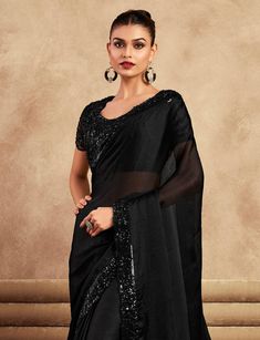 COLOR : Black FABRIC : Saree - Chiffon, Blouse - Chiffon & Net WORK : Resham Embroidery, Stones, Sequins, Lace BorderOCCASION : Wedding, Engagement, Party Wear, Festival, Sangeet NOTE : The outfit includes blouse and saree only. Petticoat is not included. READY-TO-WEAR : No STITCHING : Available as semi-stitched fabric, can be stitched using standard size option (+$30). Note: There might be a slight color variation due to lighting and flash used during photoshoot. The bright shade seen is the best closer view of fabric's color. Embroidery Stones, Saree Chiffon, Blouse Chiffon, Net Blouse, Resham Embroidery, Wedding Party Wear, Net Blouses, Party Wear Saree, Embroidered Chiffon