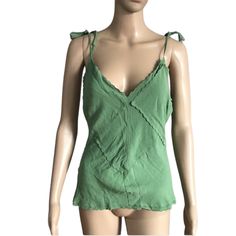 Dona Karan New York Top Green Color V Neckline Sleeveless Self Tie Spaghetti Straps. Patchwork Size 8 (Worn On A Size 2 Mannequin) Measurements Laying Flat Chest 17" Length 19"(Straps Not Included) No Returns No Holds No Trades Spring V-neck Top With Tie Straps, V-neck Top With Tie Straps For Spring, V-neck Tops With Tie Straps For Spring, Green Tank Strap Camisole For Spring, Spring V-neck Tank Top With Straps, Green Camisole With Tank Straps For Spring, Casual V-neck Top With Tie Straps, Spring Sleeveless Camisole With Tie Straps, Green Tops With Tie Straps For Day Out