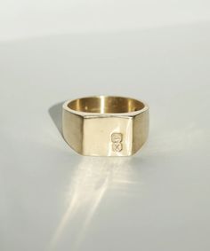 Men's Square Signet Ring Hallmarked Engagement and Wedding Jewelry by Macha Studio Brooklyn NYC Symbolic Signet Ring With Engraving For Promise, Symbolic 14k Gold Initial Ring With Polished Finish, Promise Ring With Initials In 14k Gold, Timeless Gold Signet Ring With Hallmarks, Timeless Gold Signet Ring For Promise, Symbolic Yellow Gold Signet Ring For Promise, Formal Yellow Gold Stamped Engraved Ring, Yellow Gold Engraved Initial Ring For Promise, Symbolic Formal Signet Ring With Polished Finish