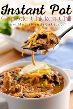 a spoonful of instant pot chipotie chicken chili is being lifted from a white bowl