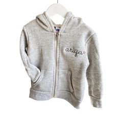 Fleece lined full zip-up hoodie. All styles include custom embroidery with your choice of phrase, font, thread color + text placement. Please make selections below. Material Content: 50% polyester, 37% ringspun cotton, 13% rayon Mockups provided upon request, please contact us. Click here for embroidery ideas *Style runs true to size, when in doubt size up :) ﻿Matches Little Kids Zip-Up Fleece Hoodie , Big Kids Zip-Up Fleece Hoodie, + Adult Zip-Up Fleece Hoodie Casual Personalized Hooded Hoodie, Customizable Cotton Winter Hoodie, Casual Personalized Cotton Hoodie, Personalized Long Sleeve Cotton Hoodie, Winter Cotton Outerwear With Custom Embroidery, Casual Cotton Hoodie Personalized, Personalized Cotton Hoodie For Winter, Personalized Cotton Sweatshirt For Winter, Customizable Cotton Hooded Hoodie