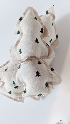 three pieces of cloth with trees on them