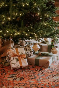 presents under the christmas tree with lights